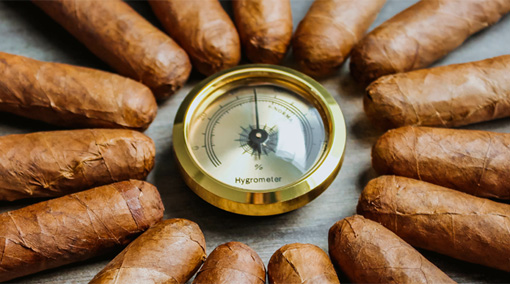 cigars encircle a hygrometer